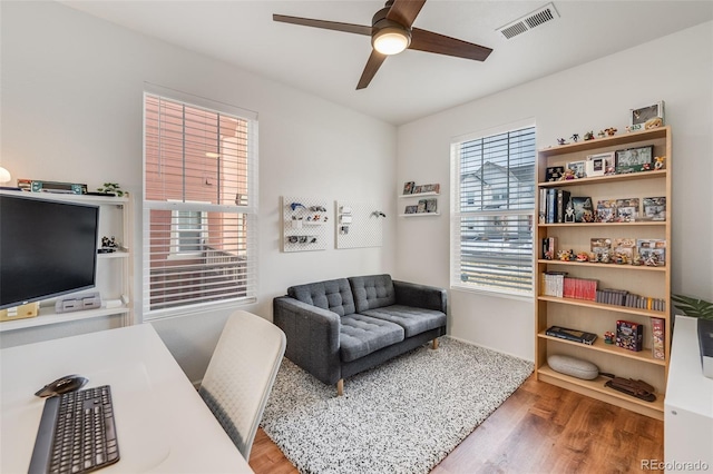 interior space featuring hardwood / wood-style flooring and ceiling fan