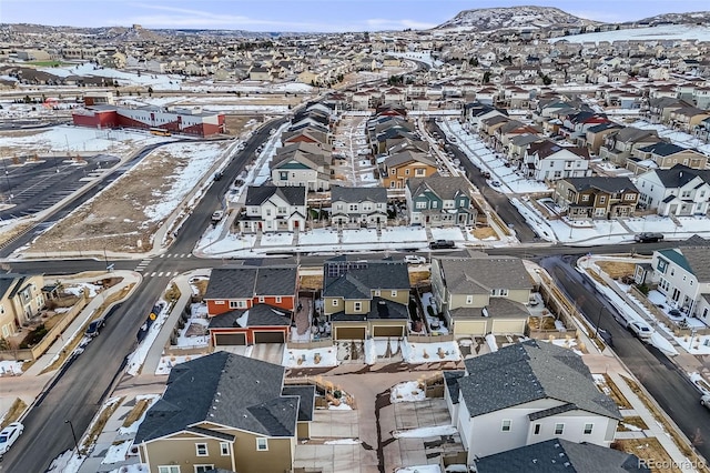 snowy aerial view with a mountain view