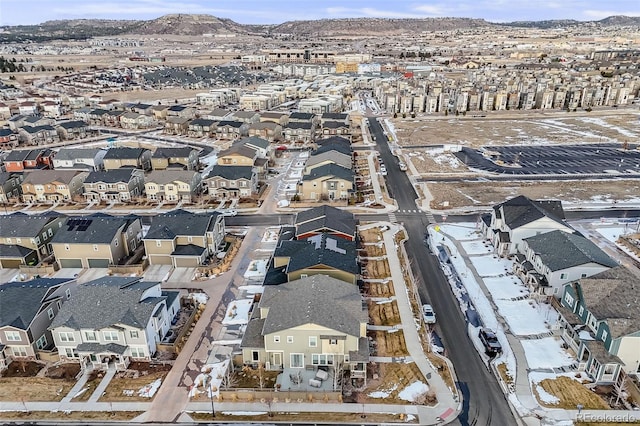 snowy aerial view featuring a mountain view