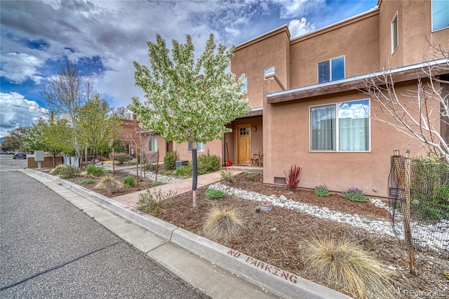 view of front of home featuring stucco siding