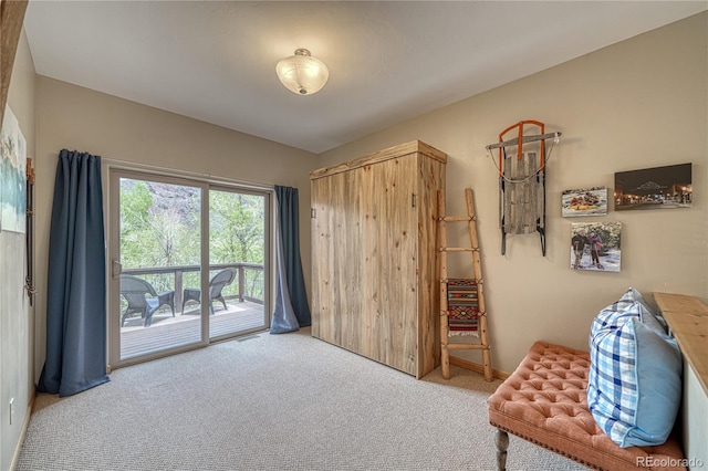 sitting room featuring visible vents and carpet floors