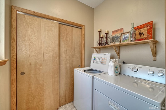 washroom featuring laundry area and washer and dryer