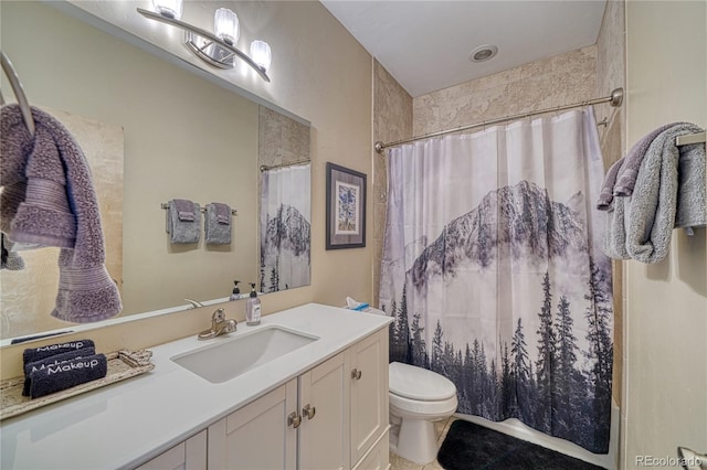 bathroom featuring vanity, curtained shower, and toilet