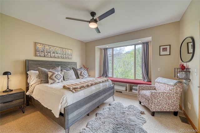 bedroom with baseboards, light colored carpet, and ceiling fan