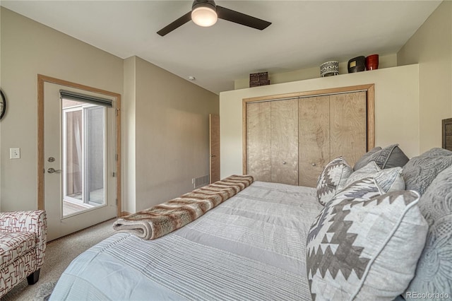 bedroom with visible vents, ceiling fan, carpet floors, a closet, and access to outside