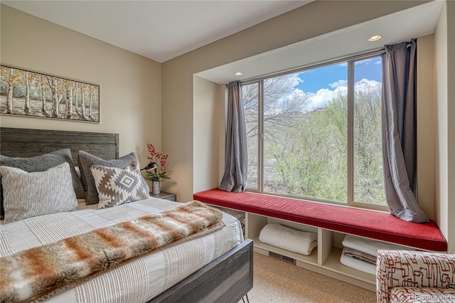 bedroom with visible vents and carpet floors