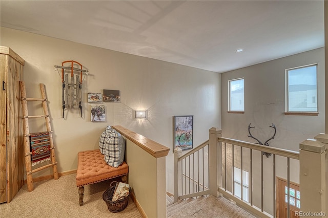 stairs featuring baseboards and carpet