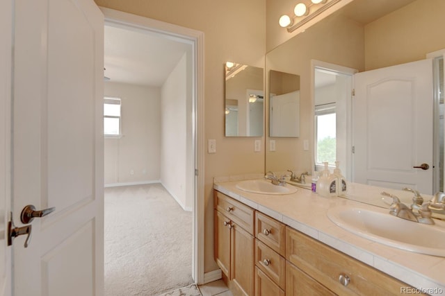 1864 Malibu Ct, Fort Lupton, CO 80621 - bathroom featuring double vanity and baseboards