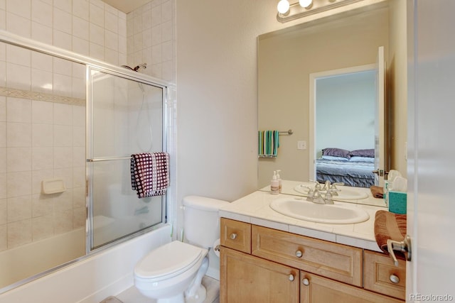 1864 Malibu Ct, Fort Lupton, CO 80621 - bathroom with vanity, toilet, combined bath / shower with glass door, and ensuite bathroom