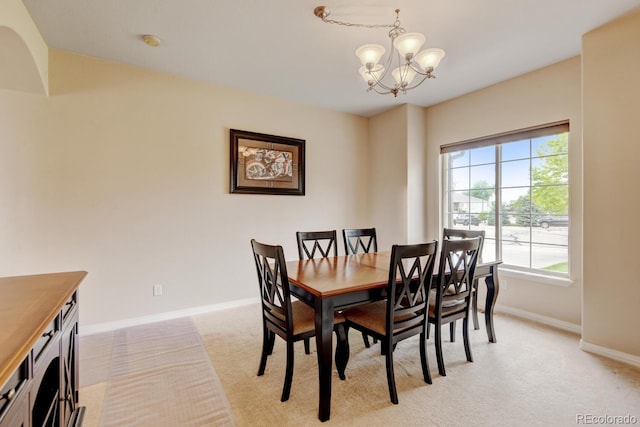 1864 Malibu Ct, Fort Lupton, CO 80621 - dining area featuring a chandelier, light colored carpet, and baseboards