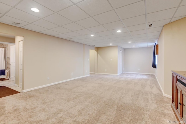 1864 Malibu Ct, Fort Lupton, CO 80621 - unfurnished living room featuring light carpet, baseboards, recessed lighting, and a drop ceiling