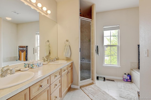 1864 Malibu Ct, Fort Lupton, CO 80621 - full bath with healthy amount of natural light, a stall shower, a garden tub, and double vanity