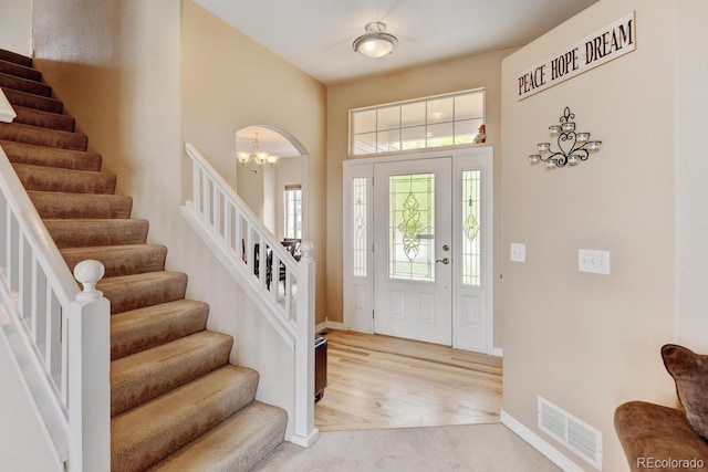 1864 Malibu Ct, Fort Lupton, CO 80621 - foyer with stairway, light colored carpet, baseboards, and a towering ceiling