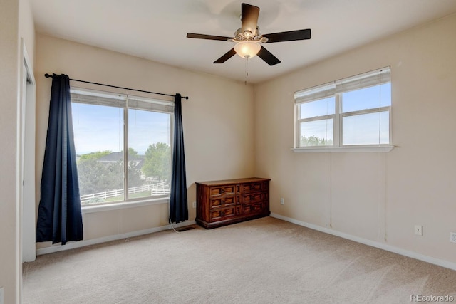 1864 Malibu Ct, Fort Lupton, CO 80621 - spare room featuring a ceiling fan, carpet flooring, and baseboards