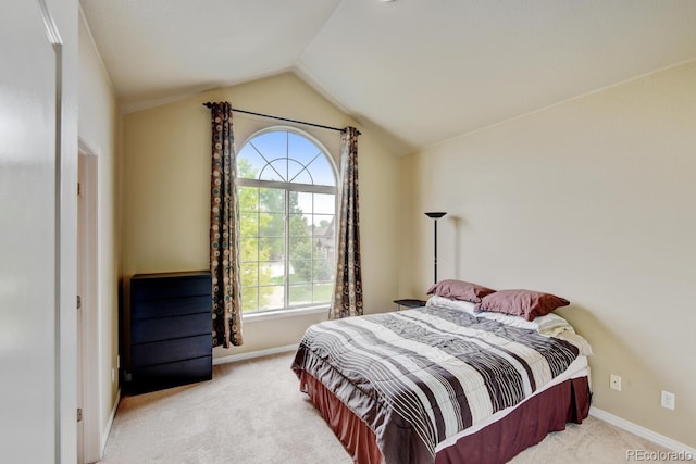 1864 Malibu Ct, Fort Lupton, CO 80621 - carpeted bedroom featuring multiple windows, lofted ceiling, and baseboards