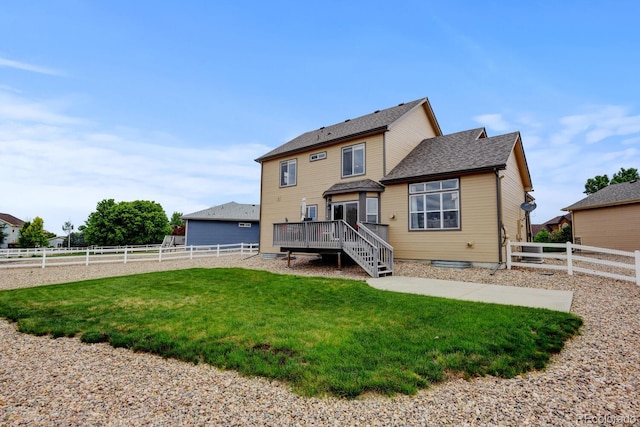 1864 Malibu Ct, Fort Lupton, CO 80621 - rear view of house with a wooden deck, stairs, and a shingled roof