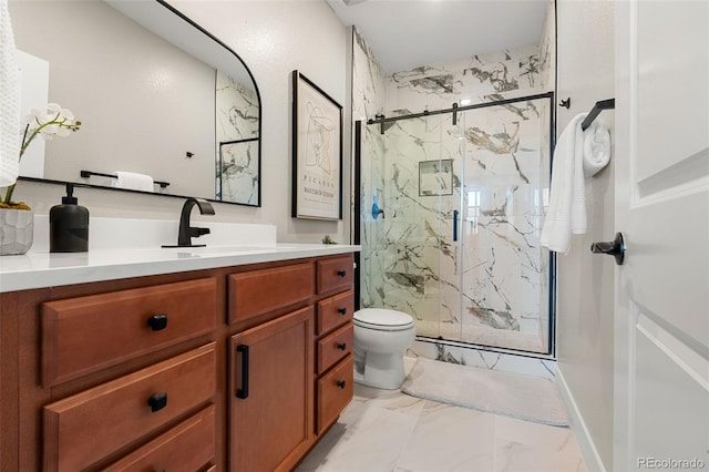 full bath with a marble finish shower, toilet, marble finish floor, and vanity