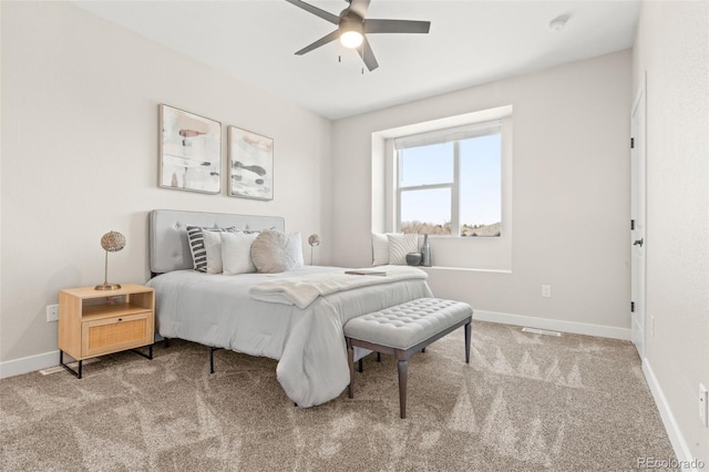 bedroom featuring a ceiling fan, baseboards, and carpet floors