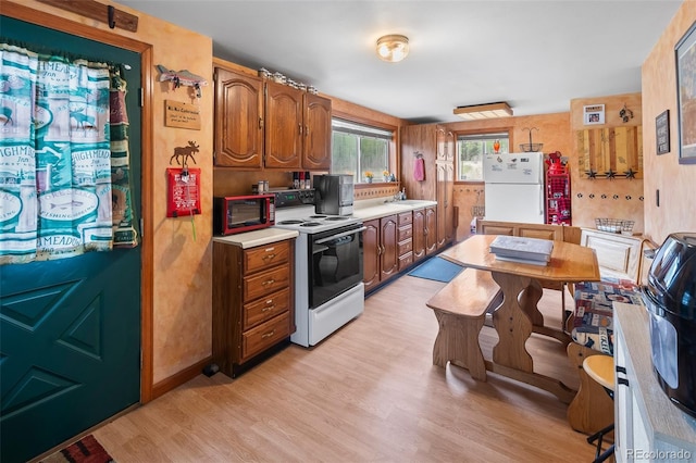 584 Old Squaw Rd, Como, CO 80432 - kitchen featuring electric stove, freestanding refrigerator, a sink, light wood finished floors, and light countertops