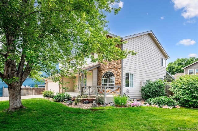 5721 S Jellison St, Littleton, CO 80123 - view of front of home featuring stone siding, covered porch, and driveway