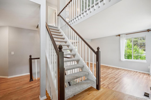 5721 S Jellison St, Littleton, CO 80123 - staircase with wood finished floors and baseboards