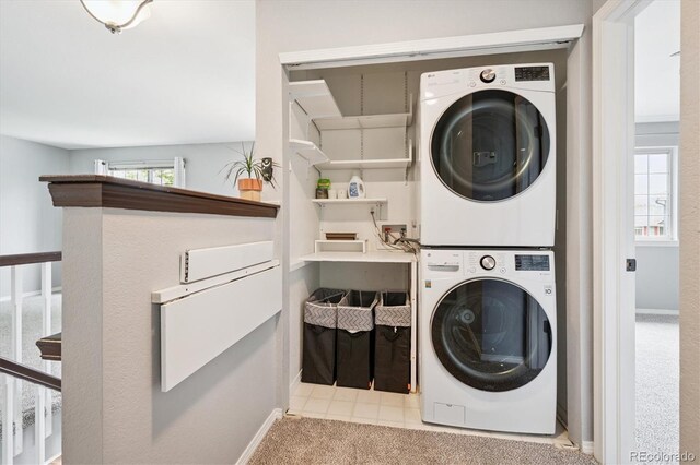 5721 S Jellison St, Littleton, CO 80123 - laundry area featuring estacked washer and dryer and baseboards