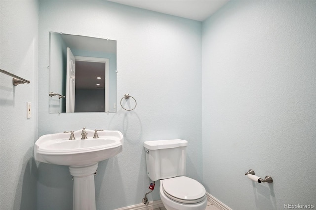5721 S Jellison St, Littleton, CO 80123 - bathroom featuring toilet and baseboards