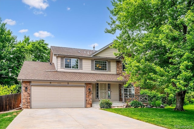 5721 S Jellison St, Littleton, CO 80123 - view of front of property with concrete driveway, stone siding, covered porch, and roof with shingles