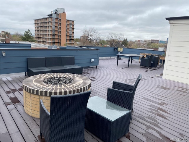 336 E 1st Ave Unit 310, Denver, CO 80203 - deck featuring a fire pit