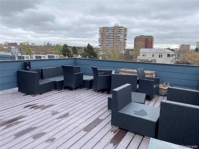336 E 1st Ave Unit 310, Denver, CO 80203 - wooden terrace with outdoor lounge area and a view of city