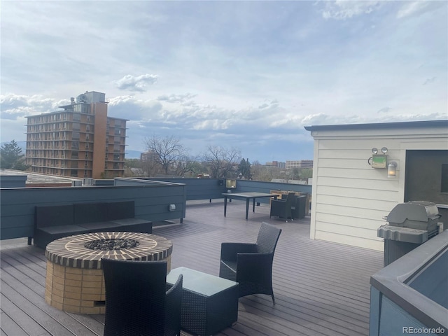 336 E 1st Ave Unit 310, Denver, CO 80203 - wooden deck featuring outdoor lounge area