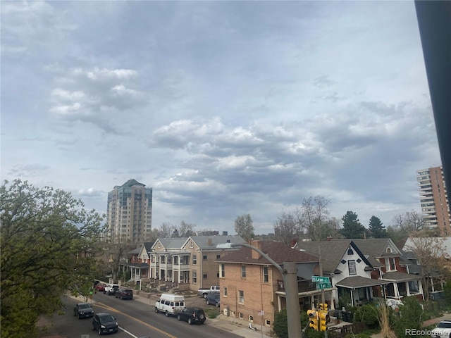 336 E 1st Ave Unit 310, Denver, CO 80203 - view of asphalt road with sidewalks and curbs