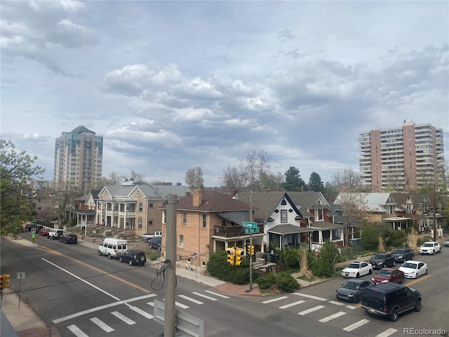 336 E 1st Ave Unit 310, Denver, CO 80203 - view of asphalt street featuring sidewalks, a residential view, and curbs