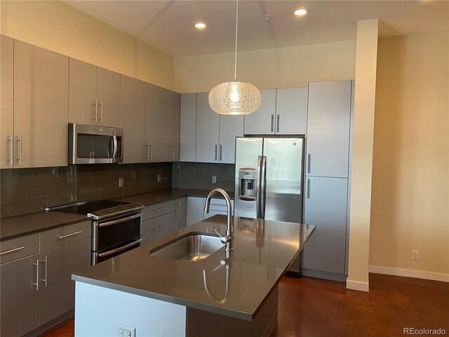 336 E 1st Ave Unit 310, Denver, CO 80203 - kitchen featuring stainless steel appliances, dark countertops, backsplash, recessed lighting, and finished concrete floors