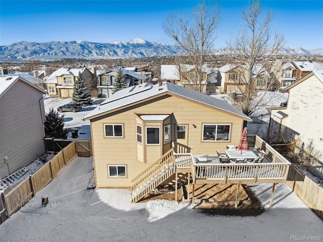 view of front facade with a deck with mountain view