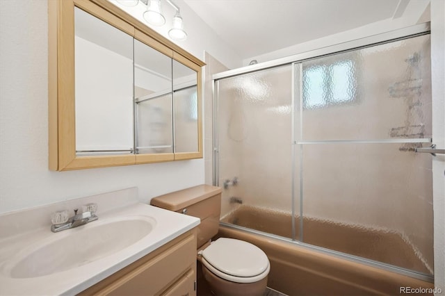 8045 S Wagon Wheel Rd, Morrison, CO 80465 - bathroom with vanity, combined bath / shower with glass door, and toilet