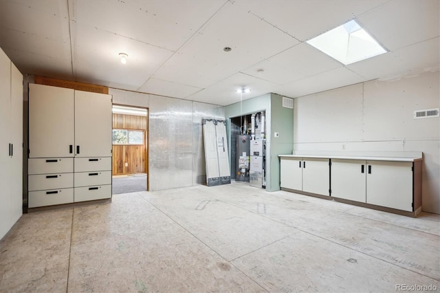 8045 S Wagon Wheel Rd, Morrison, CO 80465 - interior space featuring water heater and a skylight