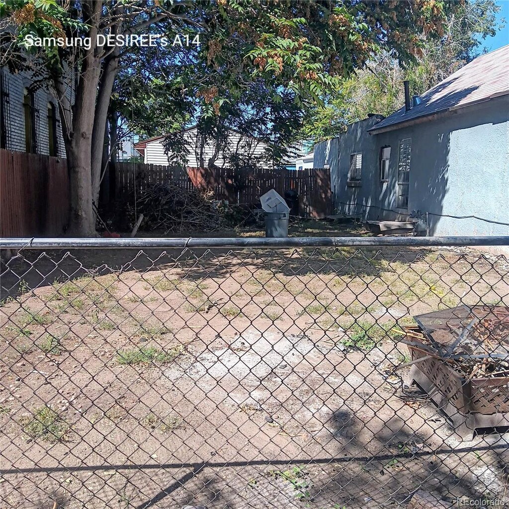 2831 Lawrence St, Denver, CO 80205 - details with fence