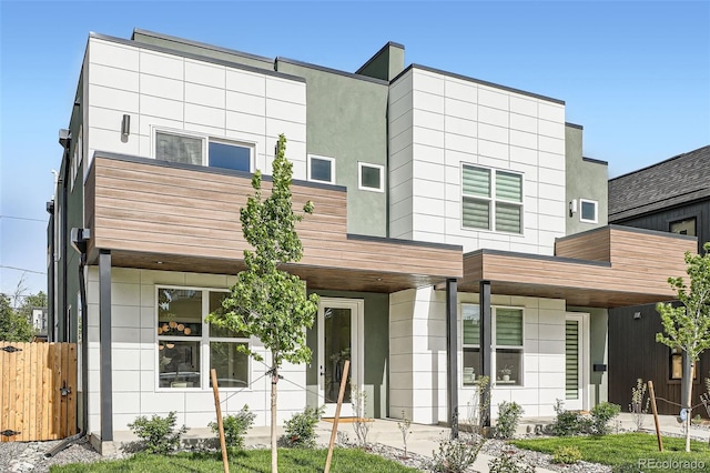 modern home featuring fence