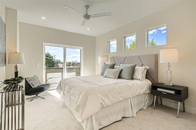 bedroom featuring access to exterior, light colored carpet, multiple windows, and recessed lighting