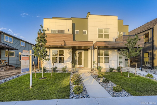 2466 S Cherokee St, Denver, CO 80223 - contemporary home with a front lawn and stucco siding