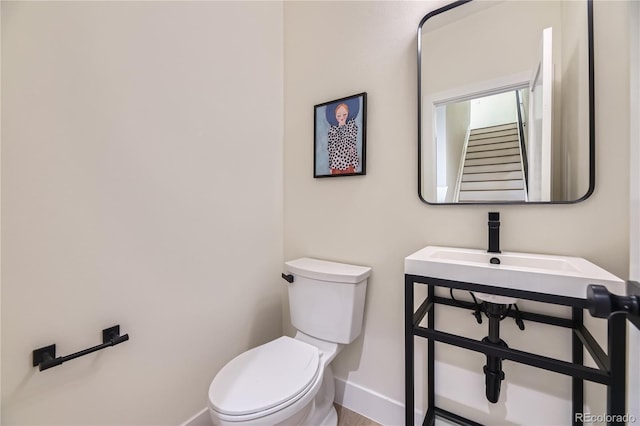 2466 S Cherokee St, Denver, CO 80223 - half bath featuring baseboards and toilet
