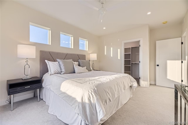 2466 S Cherokee St, Denver, CO 80223 - bedroom with light colored carpet, a walk in closet, ceiling fan, recessed lighting, and a closet