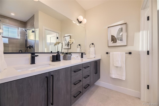 2466 S Cherokee St, Denver, CO 80223 - full bathroom with double vanity, a tile shower, and tile patterned flooring