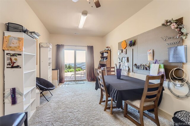 dining room with ceiling fan and carpet floors