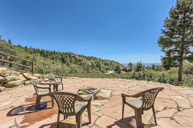 view of patio with a wooded view