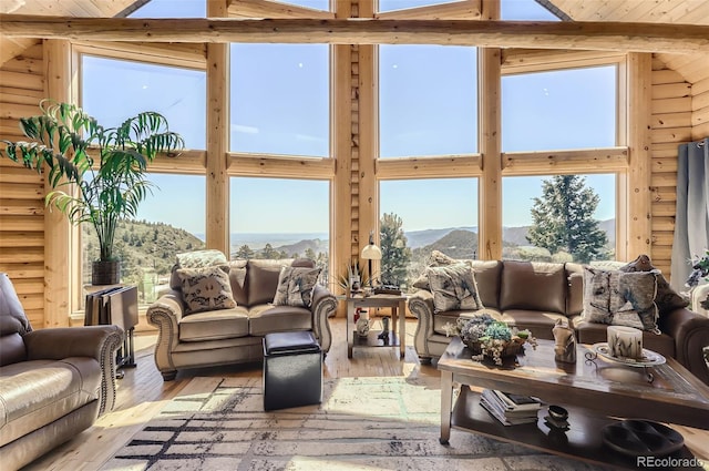 sunroom / solarium featuring a mountain view