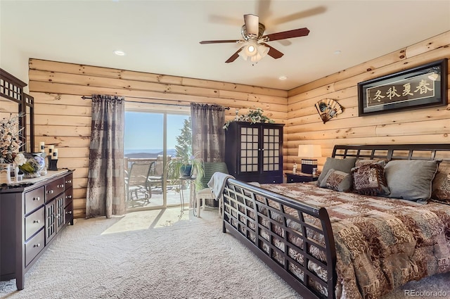 carpeted bedroom featuring access to exterior and ceiling fan