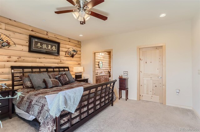 carpeted bedroom with ceiling fan and log walls