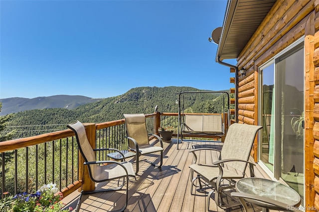 wooden terrace with a mountain view